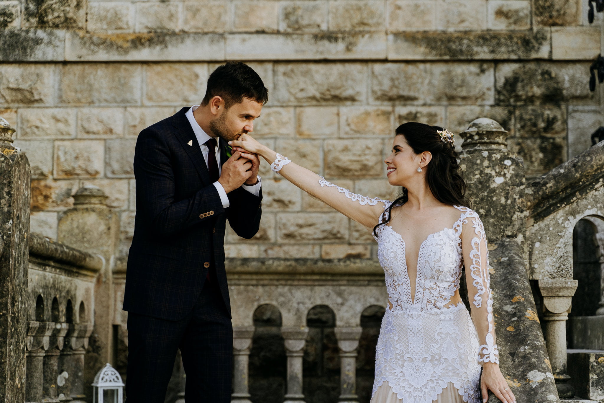 Forte da Cruz wedding exterior portrait session couple groom kissing hand of bride